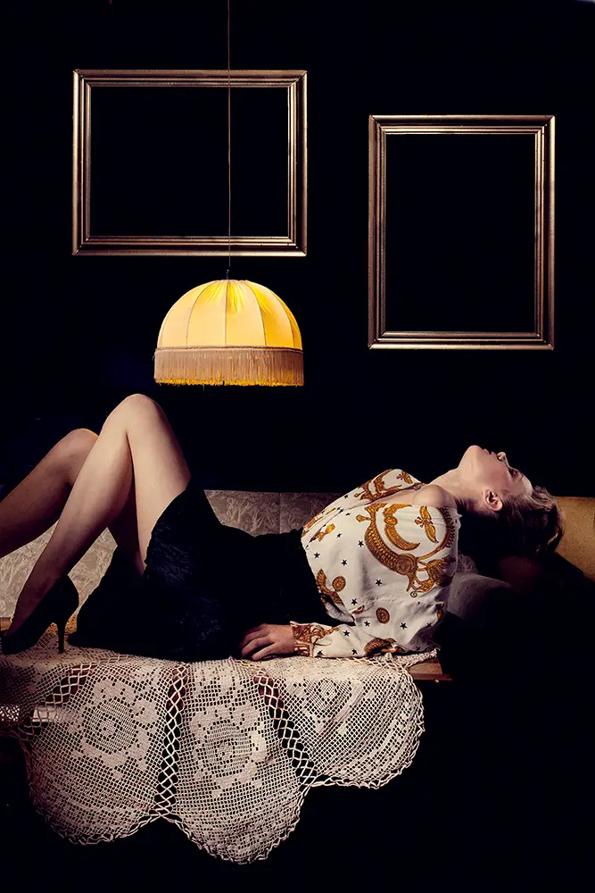 woman laying on sofa